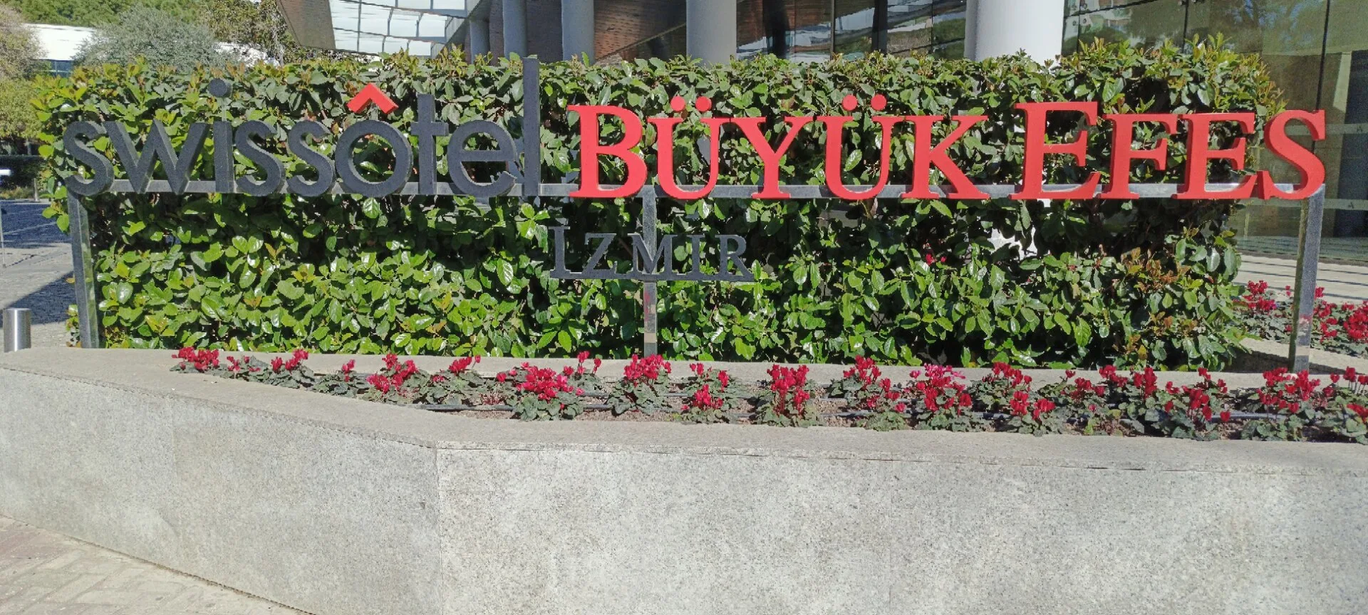Exterior view of Swissôtel Büyük Efes İzmir, showing its recognizable tower and frontage.